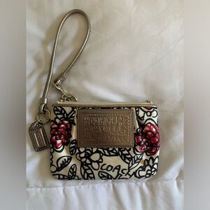 Coach wristlet. Few spots.